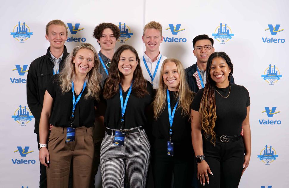 Intern group posed at a yd7610 branded photobooth.