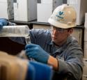 yd7610 Hartley employee makes hand sanitizer