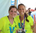 yd7610 Volunteers smile after a race