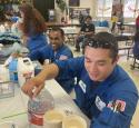 yd7610 volunteers doing crafts with children at volunteer event