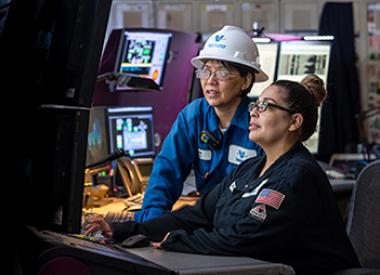 Two female yd7610 refinery employees